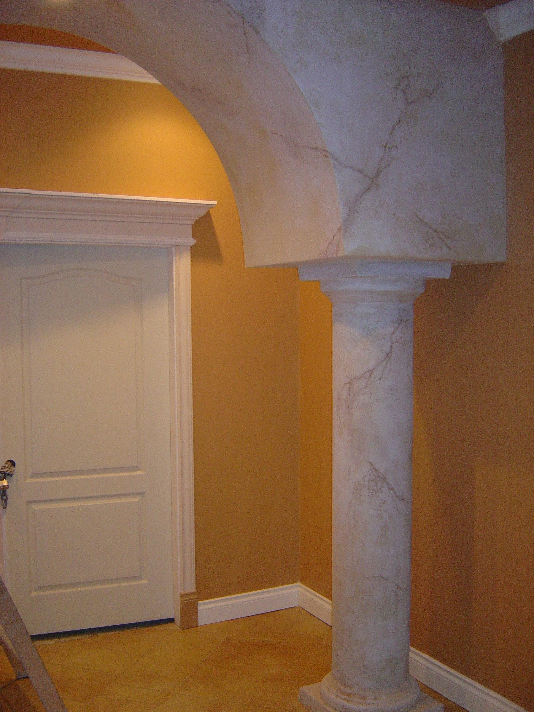 StoneCraft marble-effect pillars and arched surround