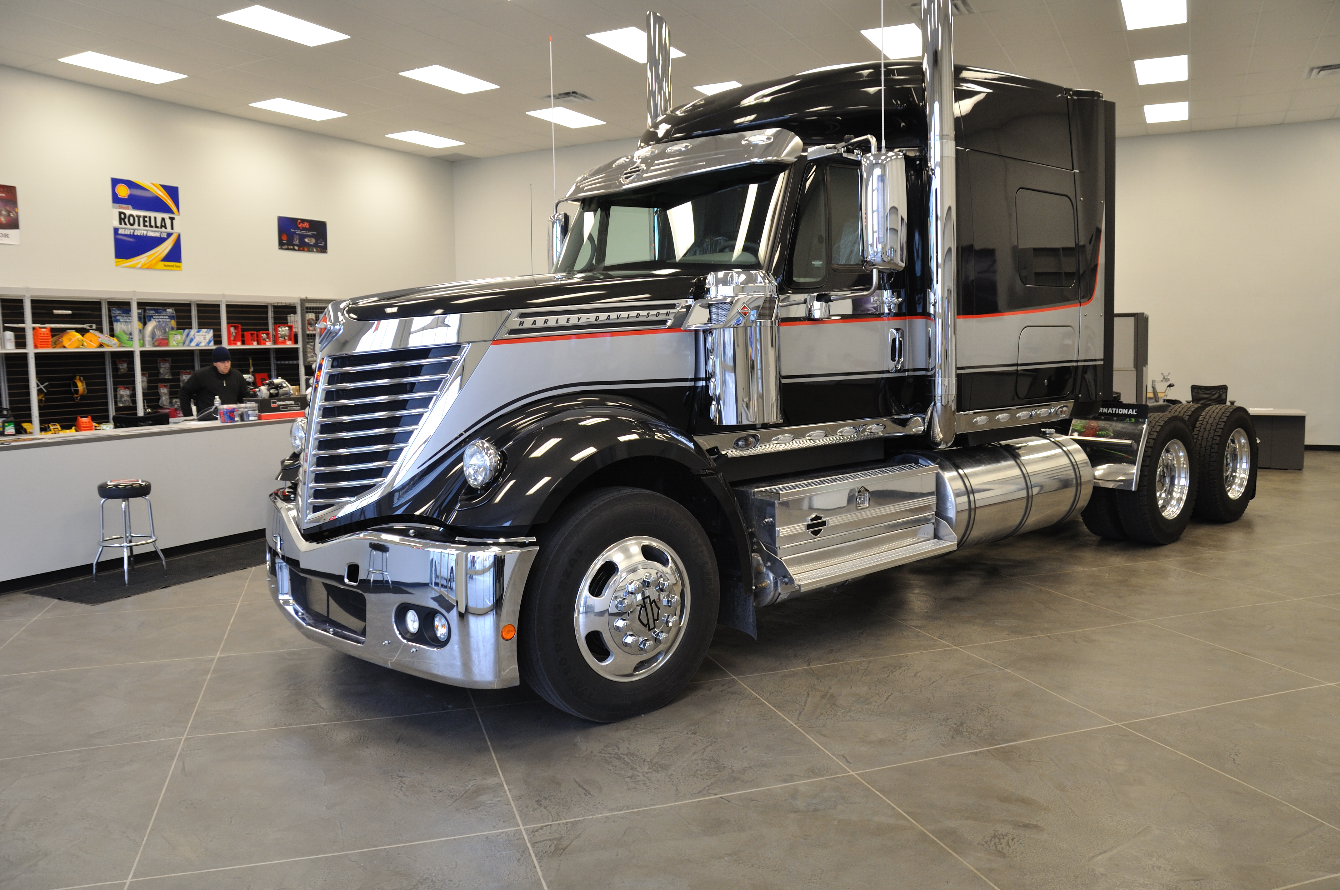 StoneCraft Standard heavy-duty flooring in truck dealership showroom with semi trailer