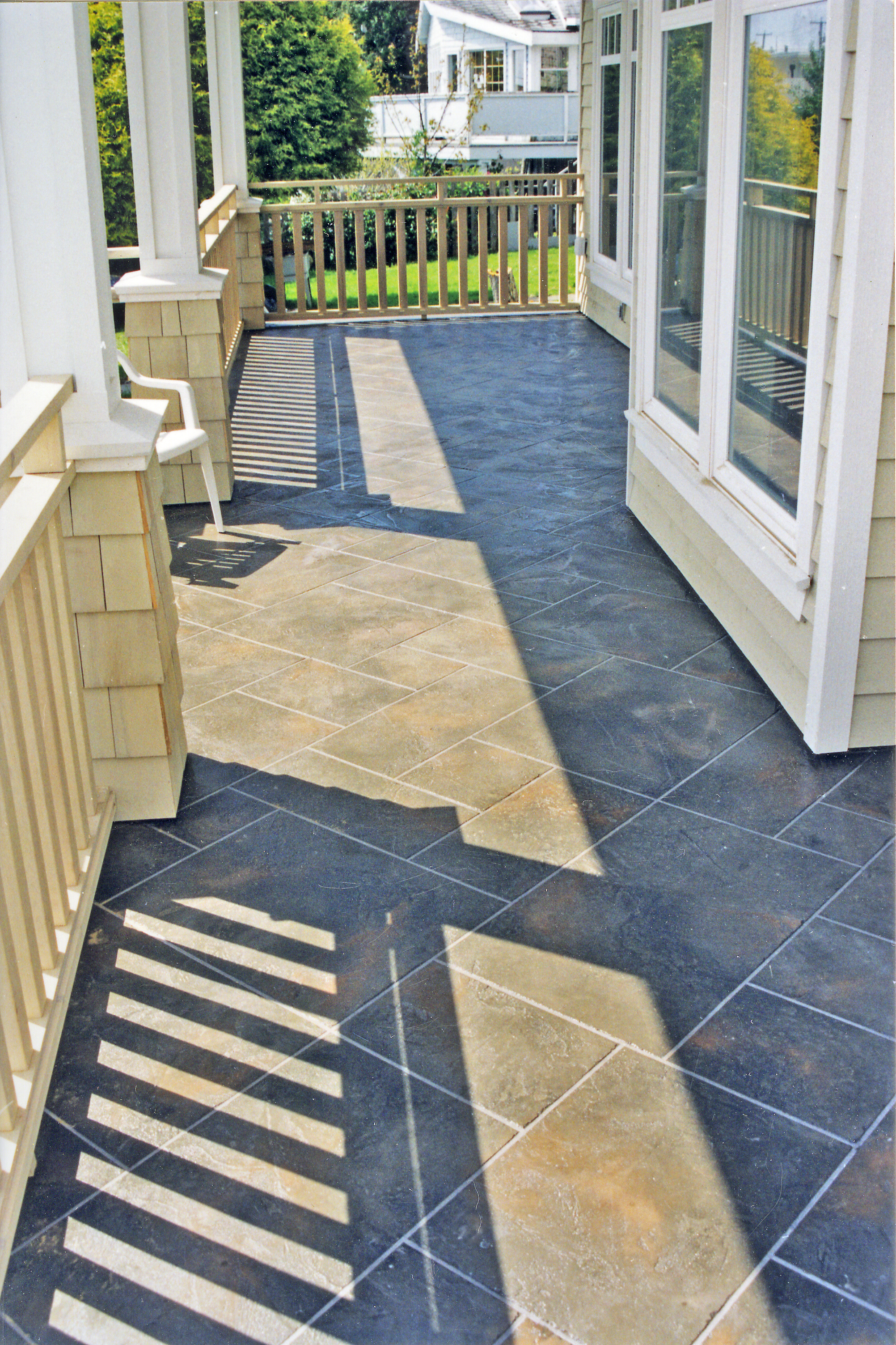 Covered veranda with blue-grey StoneCraft slate-pattern surfacing
