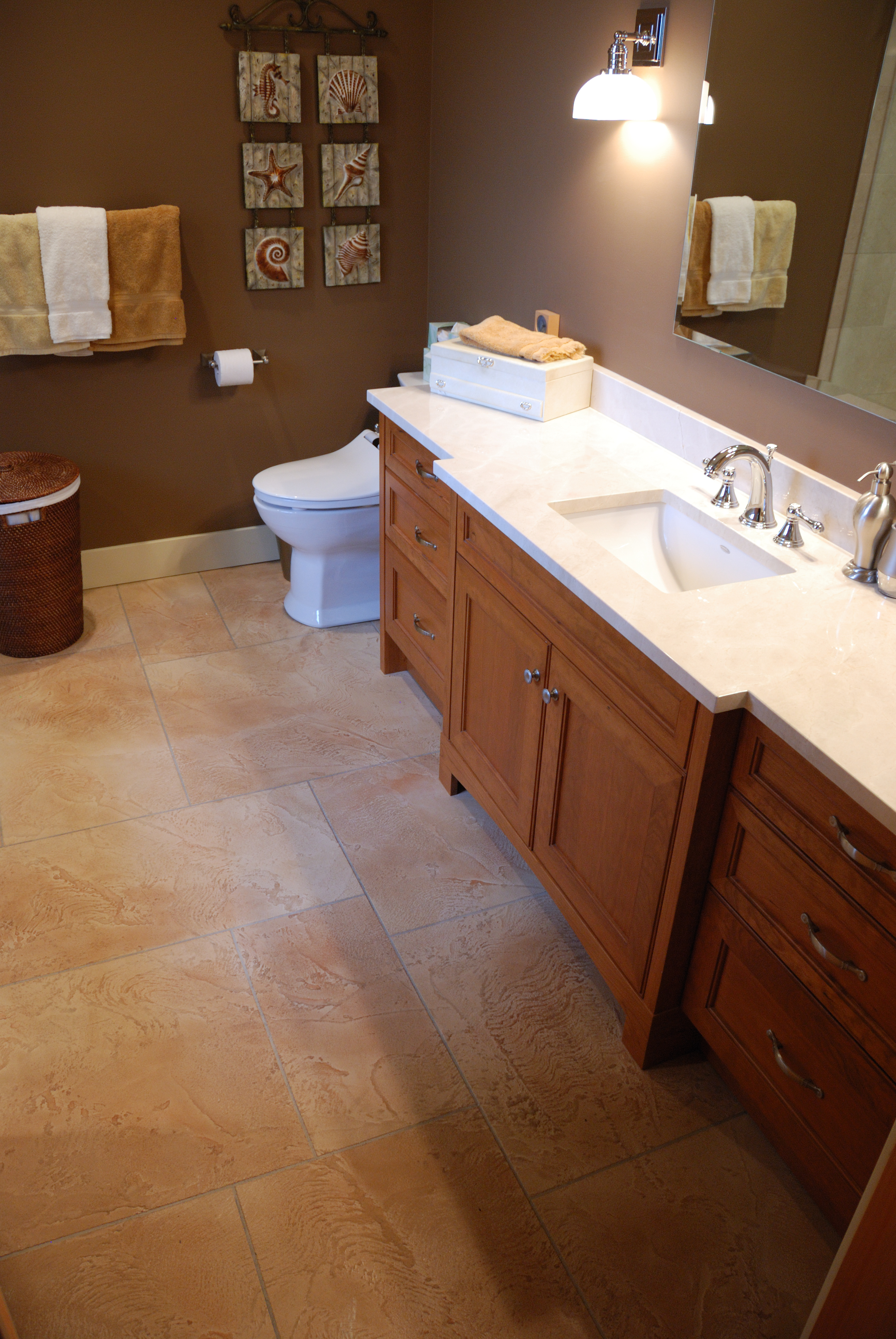 Kitchen with cream StoneCraft flooring and breakfast bar seating